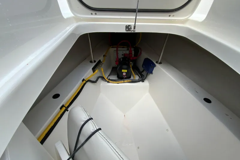 Slide: The Image of Interior view of 2026 Pursuit DC 326 Dual Console boat storage compartment. - 40