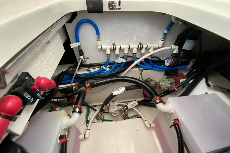 Slide: The Image of 2026 Pursuit DC 326 Dual Console boat wiring and plumbing system close-up. - 53
