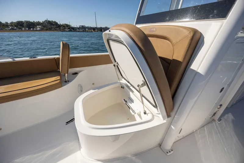 Slide: The Image of 2021 Sea Hunt Escape 27 boat interior with open storage compartment. - 18