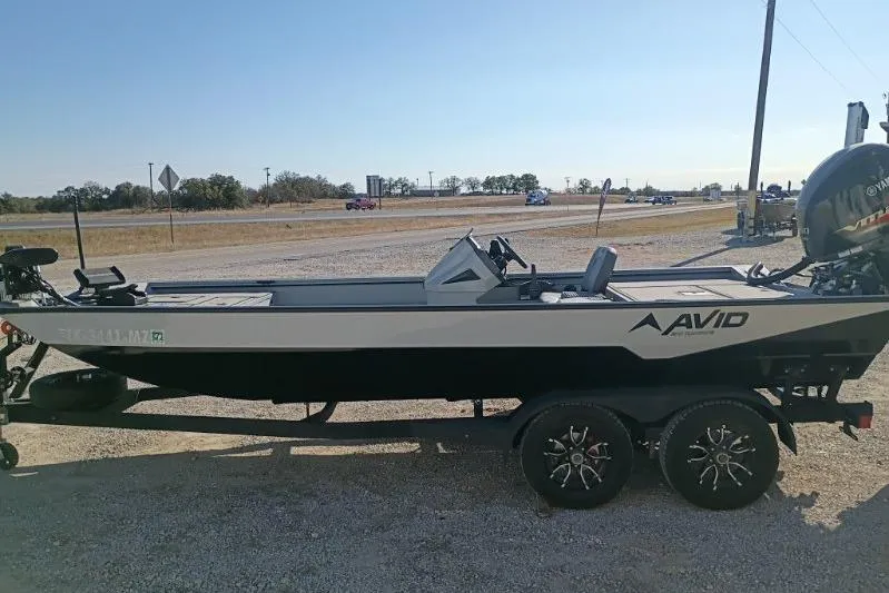 Slide: The Image of 2025 Avid 20 Rogue SC boat on trailer, parked outdoors. - 5