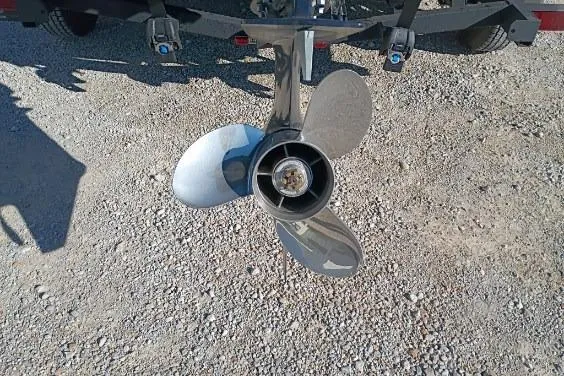 Slide: The Image of Propeller of 2025 Avid 20 Rogue SC boat on gravel surface. - 7