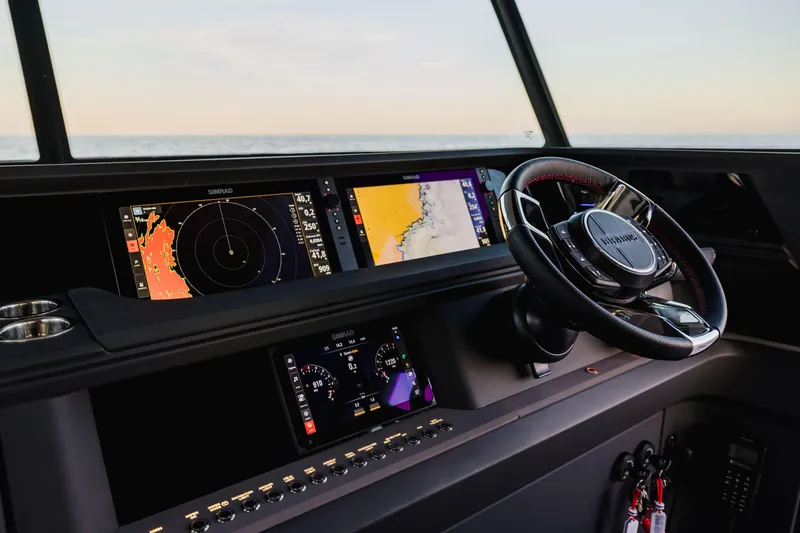 Slide: The Image of 2026 Axopar 45 XC AC Sandstone Lithium dashboard with advanced navigation displays. - 6