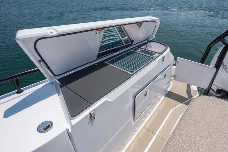 Slide: The Image of 2026 Axopar 45 XC Cross Cabin boat with open deck storage and grill. - 7