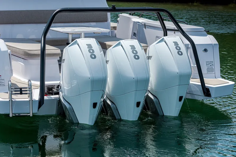 Slide: The Image of 2026 Axopar 45 XC Cross Cabin with triple Mercury 300 outboard engines. - 6