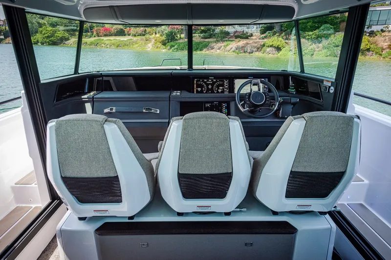 Slide: The Image of Interior view of 2026 Axopar 45 XC Cross Cabin with modern helm and seating. - 22