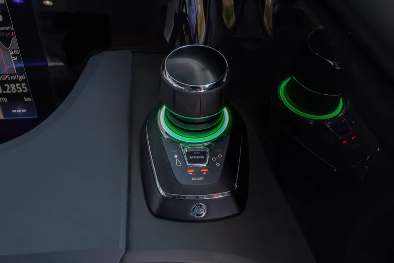 Slide: The Image of Joystick control system in 2026 Axopar 45 XC Cross Cabin with illuminated green ring. - 24