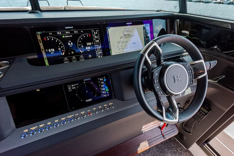 Slide: The Image of Steering wheel and dashboard of 2026 Axopar 45 XC Cross Cabin boat. - 23