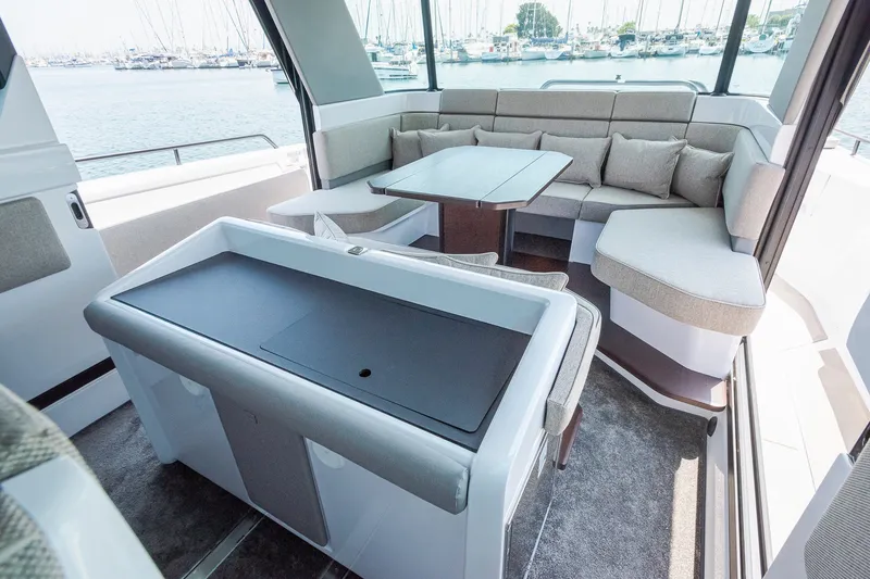 Slide: The Image of Luxurious interior of 2026 Axopar 45 XC Cross Cabin with seating and table. - 25