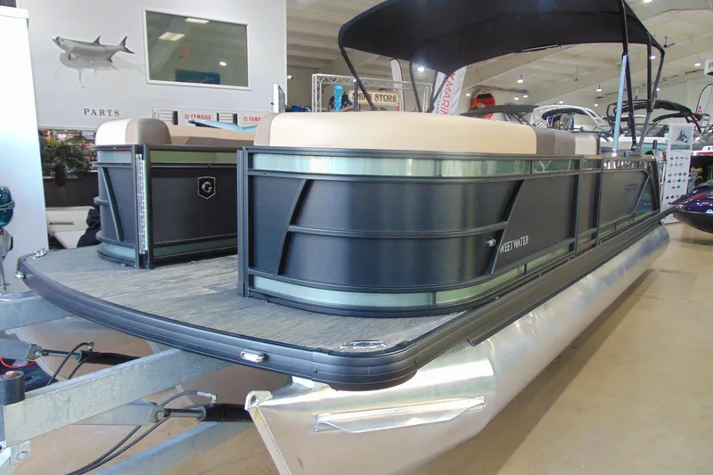 Slide: The Image of 2026 Godfrey Sweetwater 2286 DT 27" iMPACT Tri-Toon pontoon boat in showroom display. - 4