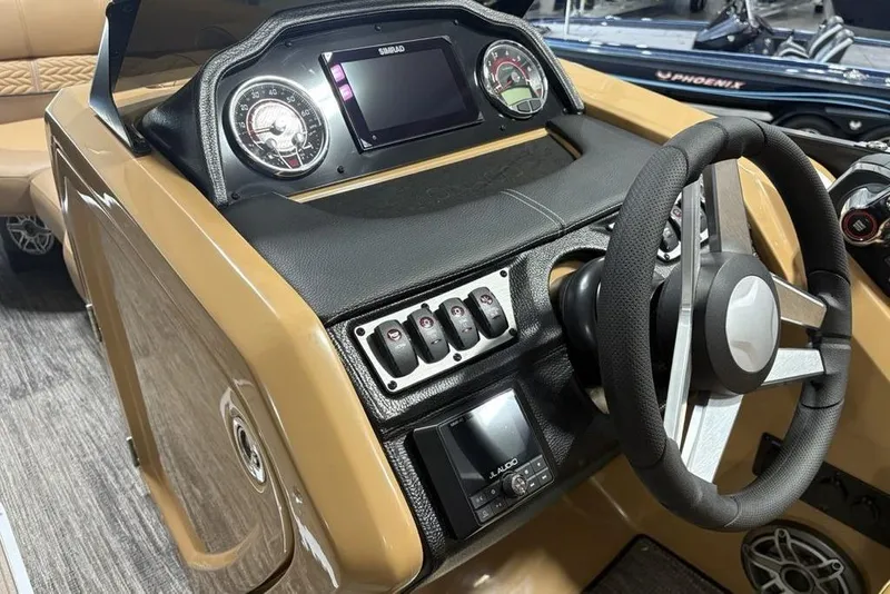 Slide: The Image of 2025 Godfrey AquaPatio 235 DFL dashboard with steering wheel and control panel. - 13