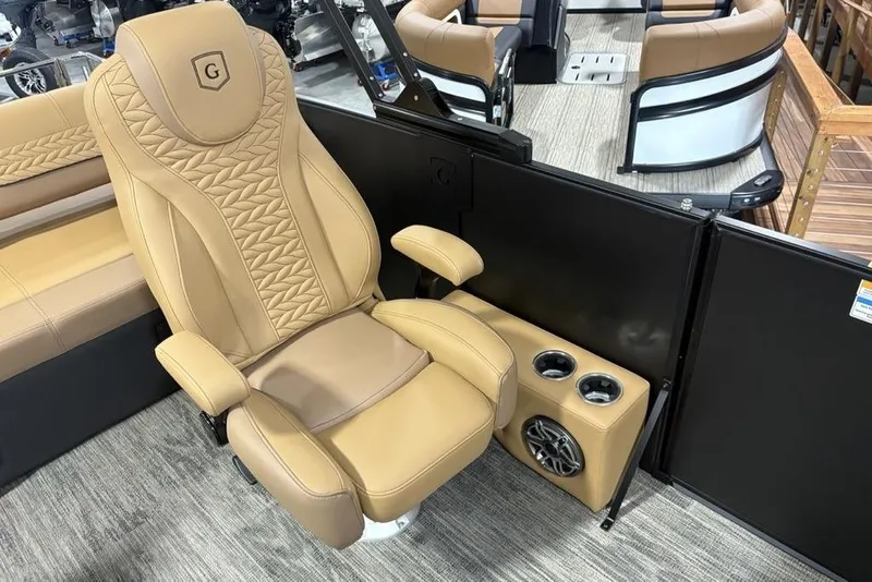 Slide: The Image of Luxurious seating on 2025 Godfrey AquaPatio 235 DFL pontoon boat with cup holders and speaker. - 22