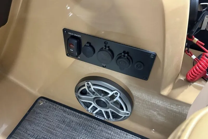 Slide: The Image of Control panel and speaker on 2025 Godfrey AquaPatio 235 DFL boat. - 23