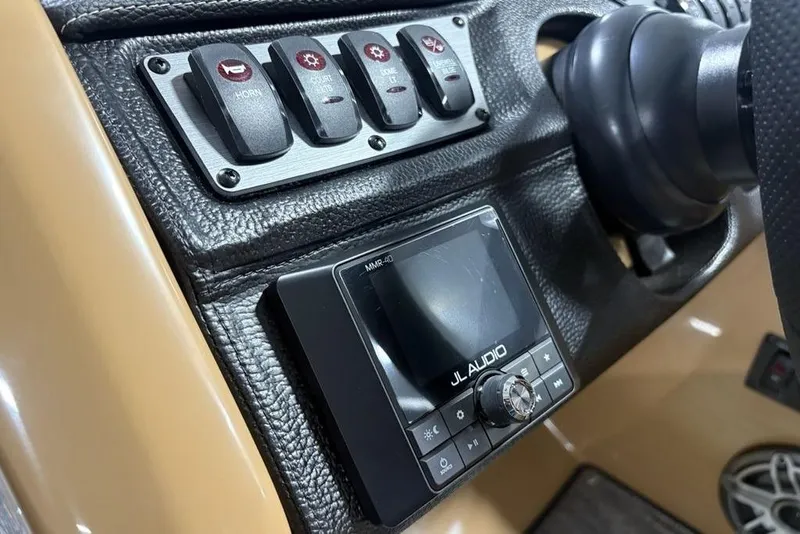Slide: The Image of Control panel of 2025 Godfrey AquaPatio 235 DFL with JL Audio system and switches. - 25