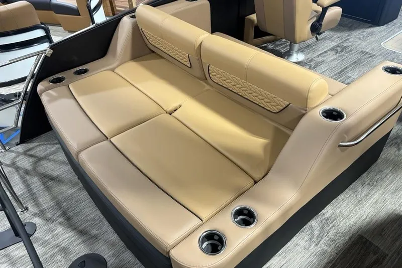 Slide: The Image of Luxurious seating on 2025 Godfrey AquaPatio 235 DFL pontoon boat with cup holders and armrests. - 27