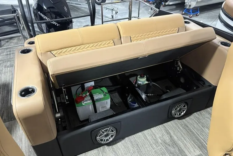 Slide: The Image of 2025 Godfrey AquaPatio 235 DFL boat seat storage with battery and speakers. - 29