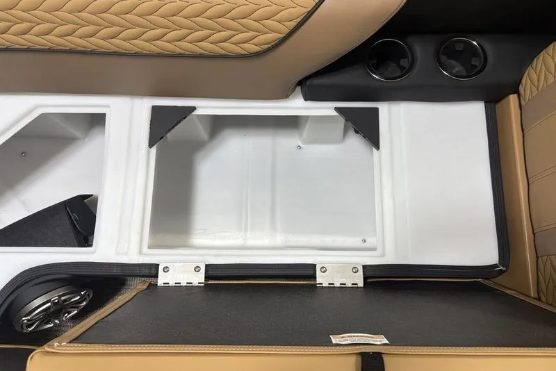 Slide: The Image of 2025 Godfrey AquaPatio 235 DFL interior storage compartment with tan quilted seating and cup holders. - 5