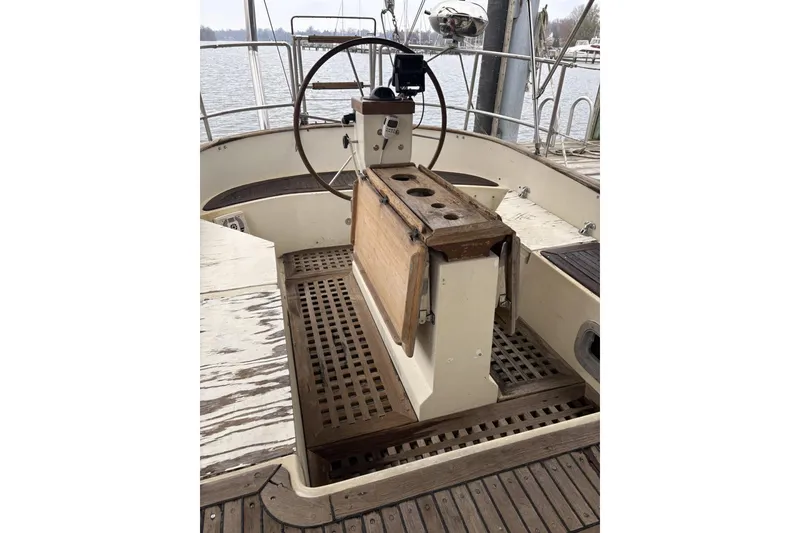 Slide: The Image of Control panel of a 1980 Tanton Sailboat with wooden flooring and levers. - 14