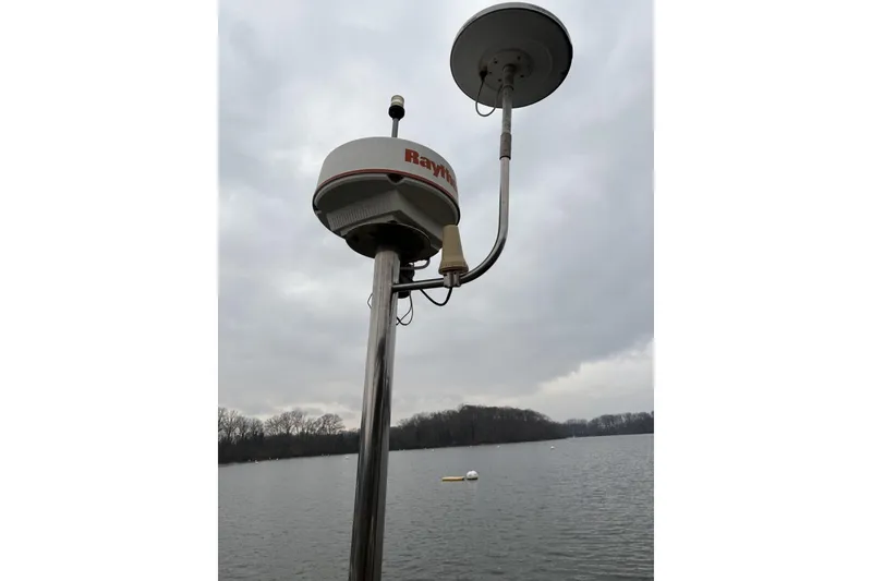 Slide: The Image of 1980 Tanton sailboat deck with hatches and rigging, docked at marina. - 17