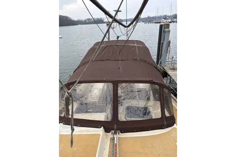 Slide: The Image of 1980 Tanton sailboat docked at marina, reflecting on calm water. - 20