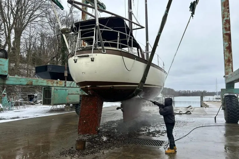 Slide: The Image of Interior of 1980 Tanton sailboat with wooden cabinetry and storage space. - 27