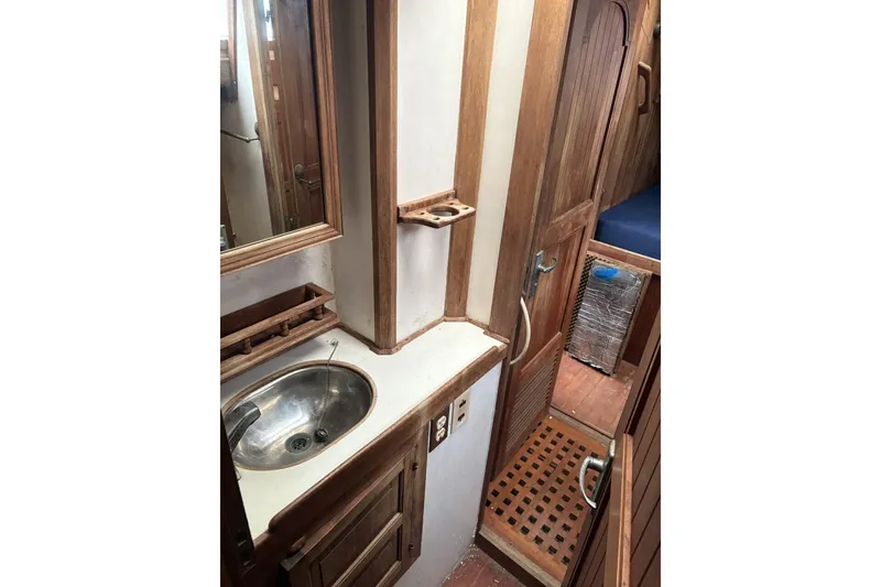 Slide: The Image of Interior of 1980 Tanton Sailboat with wooden doors and flooring. - 6