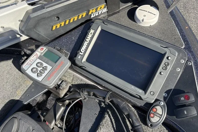 Slide: The Image of 2018 Skeeter ZX225 boat dashboard with Lowrance Elite GPS and Minn Kota controls. - 12