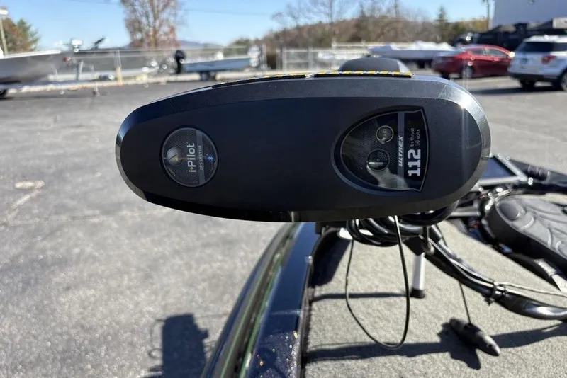 Slide: The Image of 2018 Skeeter ZX225 boat with Minn Kota i-Pilot trolling motor, model 112, in a parking lot. - 13