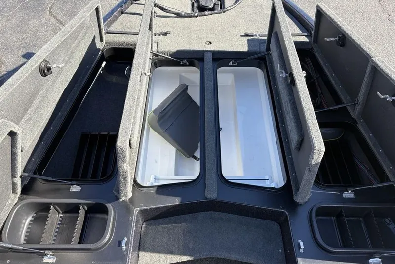 Slide: The Image of 2018 Skeeter ZX225 boat storage compartments open, showcasing spacious interior layout. - 15
