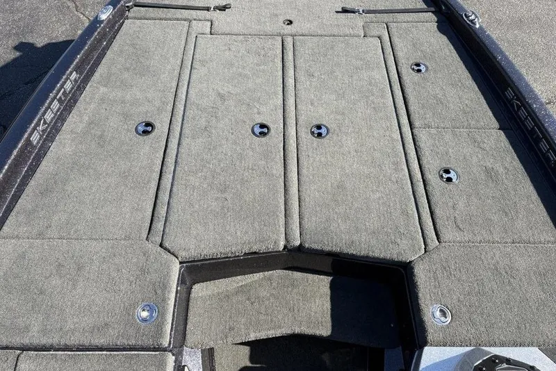 Slide: The Image of 2018 Skeeter ZX225 boat deck with carpeted storage compartments and sleek design. - 17