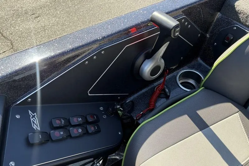 Slide: The Image of 2018 Skeeter ZX225 boat interior with control panel and seat detail. - 19