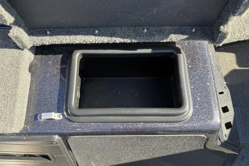 Slide: The Image of 2018 Skeeter ZX225 storage compartment with open lid, showcasing interior space. - 22