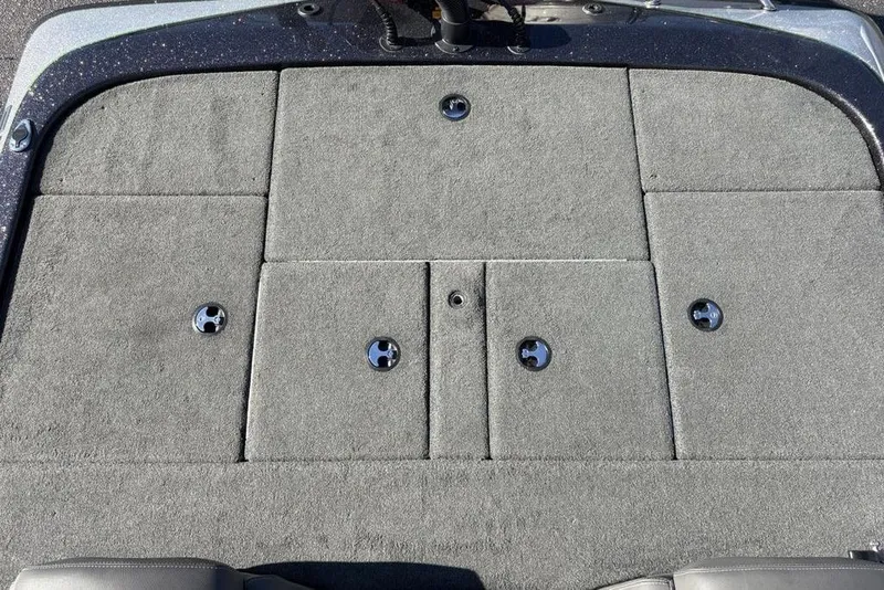 Slide: The Image of 2018 Skeeter ZX225 boat deck with gray carpet and storage compartments. - 29