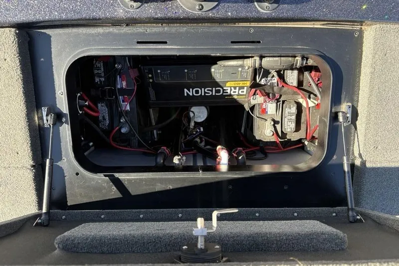 Slide: The Image of 2018 Skeeter ZX225 boat battery compartment with wiring and Precision charger. - 31