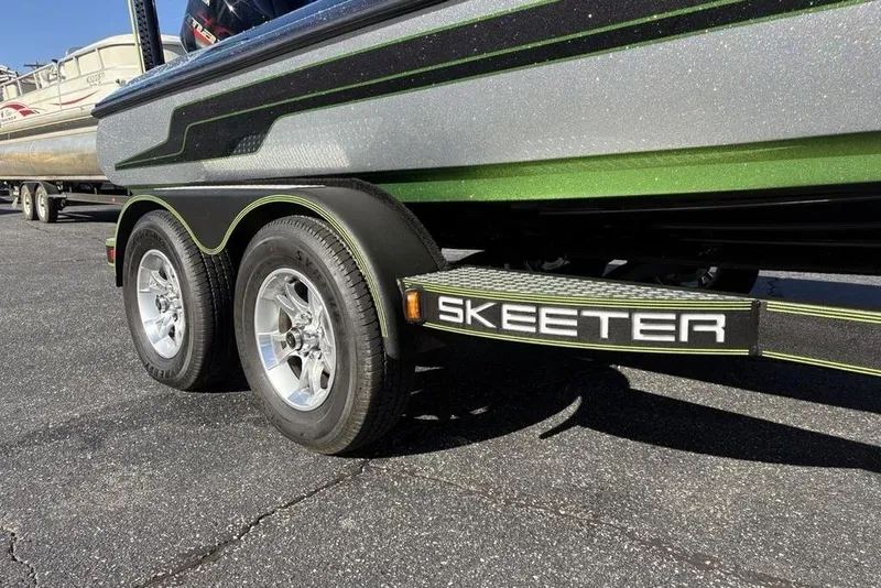 Slide: The Image of 2018 Skeeter ZX225 boat trailer with dual wheels and sleek design. - 33