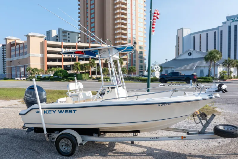The Image of 2004 Key West 186 Center Console boat on trailer, urban background, sunny day. - 0