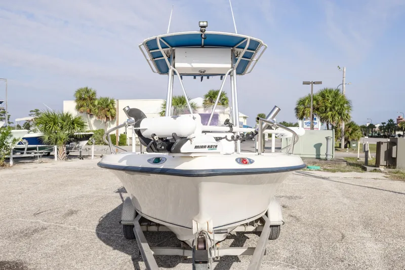 Slide: The Image of 2004 Key West 186 Center Console boat on trailer, parked outdoors. - 13
