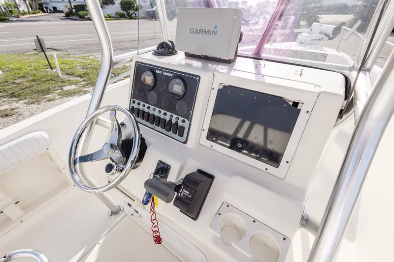 Slide: The Image of 2004 Key West 186 Center Console boat dashboard with Garmin navigation system. - 15