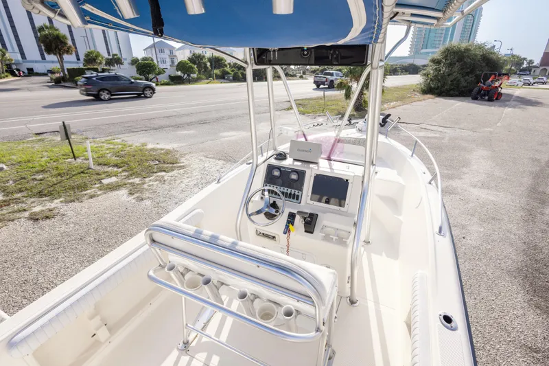 Slide: The Image of 2004 Key West 186 Center Console boat with steering wheel and navigation equipment. - 17