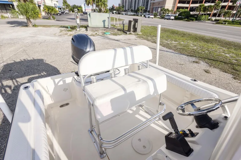 Slide: The Image of 2004 Key West 186 Center Console boat interior with steering wheel and seating. - 19