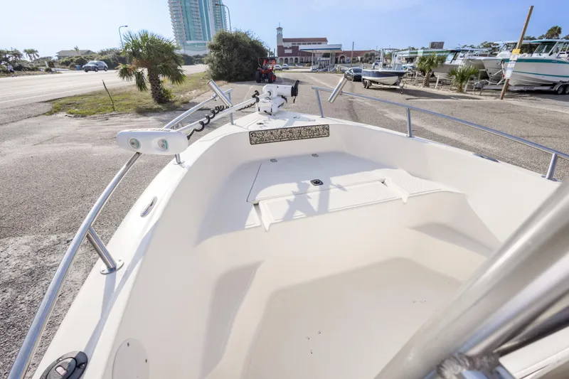 Slide: The Image of 2004 Key West 186 Center Console boat on display in a coastal setting. - 21
