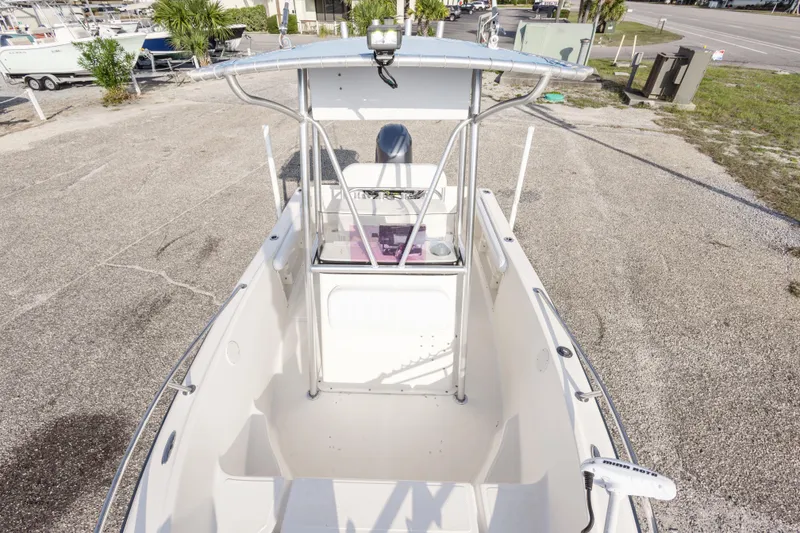 Slide: The Image of 2004 Key West 186 Center Console boat, aerial view, parked on gravel lot. - 23