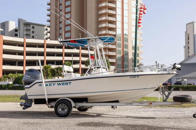 Slide: The Image of 2004 Key West 186 Center Console boat on trailer, urban background. - 3
