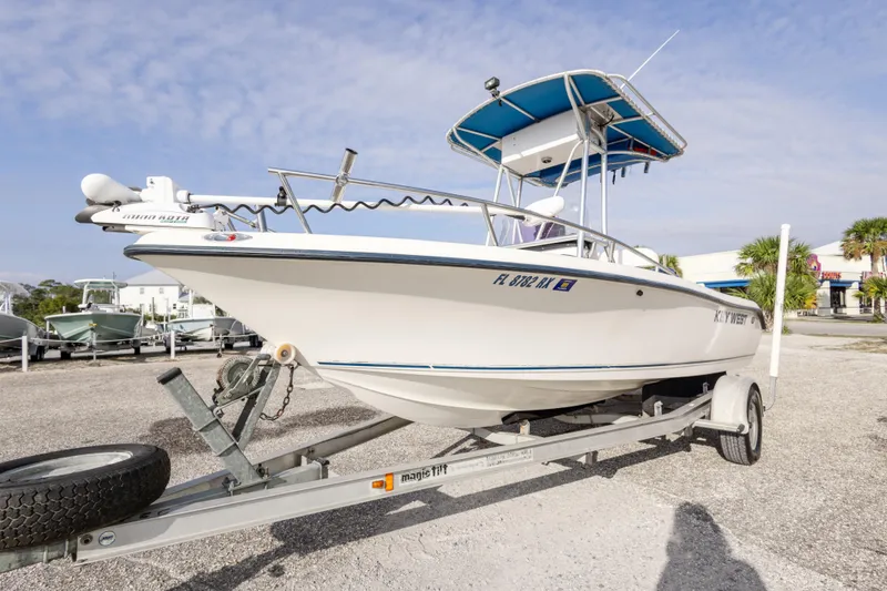 Slide: The Image of 2004 Key West 186 Center Console boat on trailer, parked outdoors. - 5