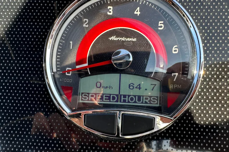 Slide: The Image of Tachometer of 2024 Hurricane SunDeck 2600 OB showing 0 mph and 64.7 hours. - 23