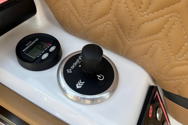 Slide: The Image of Control panel of 2024 Hurricane SunDeck 2600 OB with joystick and digital counter. - 9