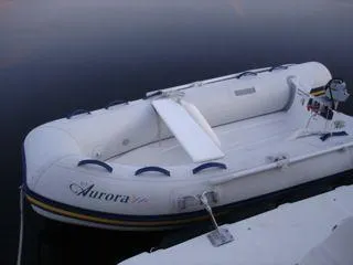 Slide: The Image of White inflatable boat on calm water, Ranger Tugs R-29, year 2010. - 10