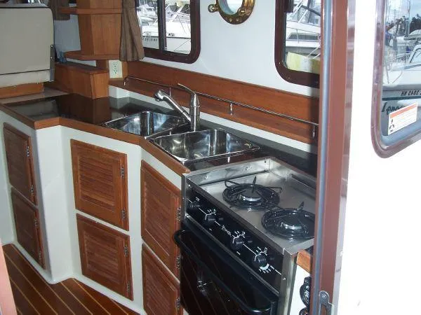 Slide: The Image of Galley area of 2010 Ranger Tugs R-29 yacht. - 16