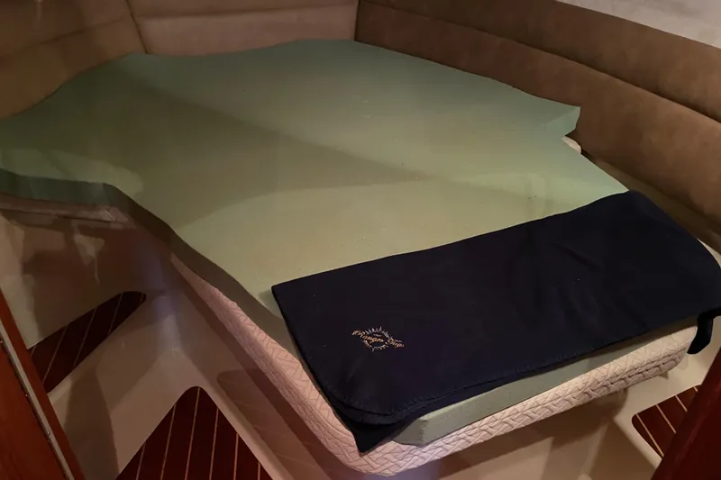 Slide: The Image of Interior cabin of 2010 Ranger Tugs R-29 with bed and blanket. - 21