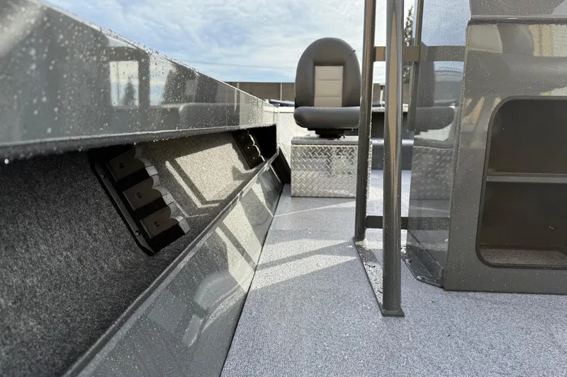 Slide: The Image of 2026 Fish Rite Angler 18 boat interior with seating and storage compartments. - 12
