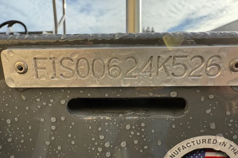 Slide: The Image of 2026 Fish Rite Angler 18 boat with identification number FIS00624K526, wet with water droplets. - 15